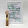 A framed certificate and a wooden toy are displayed against a white background. Produktbild-Vorschau