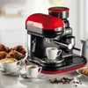 A red and black espresso machine with a built-in grinder, set on a countertop with cups of coffee, croissants, and cookies. Produktbild-Vorschau