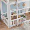 A close-up view of a white wooden bunk bed with a slide and a ball pit. Voir les images du produit