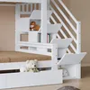 A close-up view of a white bunk bed with storage compartments and a ladder. Produktbild-Vorschau