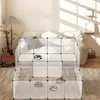 A modular pet enclosure with several hedgehogs inside, set up in a living room next to a couch and guitar. Produktbild-Vorschau