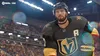 A hockey player in uniform on the ice, with a crowd in the background. Produktbild-Vorschau