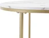 Close-up of a round table with a marble-like top and gold metal legs. Voir les images du produit