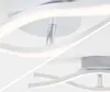 Close-up view of a modern LED ceiling light with a curved design. Produktbild-Vorschau