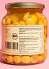 A close-up of a glass jar filled with lupini beans in brine, with a label showing nutritional information. Produktbild-Vorschau