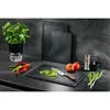 A kitchen counter scene with a basil plant, chili peppers, tomatoes, a cutting board with chopped green onions, a knife, a pepper grinder, and a mortar and pestle. Podgląd zdjęcia produktu