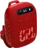 A red JBL Bluetooth speaker. Voir les images du produit