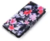A close-up, angled view of a floral patterned flip phone case. Produktbild-Vorschau