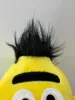 Close-up of the top of a yellow plush toy with black fuzzy hair and a black eyebrow. Produktbild-Vorschau