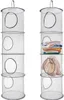 Two hanging storage organizers are shown side-by-side against a white background. The organizer on the right is partially filled with folded clothes and a stuffed animal. Produktbild-Vorschau