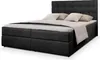 A black upholstered boxspring bed with a tufted headboard, made up with white and light gray bedding, shown against a white background. Produktbild-Vorschau