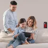A family is gathered on a couch, looking at a tablet. A small heater is visible on the wall in the background. Anteprima dell’immagine prodotto