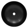 A top-down view of a black ceramic sink with a drain hole in the center. Náhled obrázku produktu