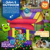A colorful play tent filled with balls, with a baby inside, and a family in the background. Produktbild-Vorschau