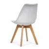 A white chair with wooden legs against a white background. Podgląd zdjęcia produktu