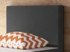 A close-up view of a bed headboard with a pillow in front of it. Produktbild-Vorschau