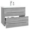 A bathroom vanity with a sink and faucet. Anteprima dell’immagine prodotto