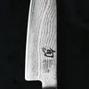 A close-up view of a knife blade with intricate patterns and branding. Náhled obrázku produktu