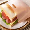 A sandwich in a paper bag on a plate. Produktbild-Vorschau
