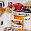 A miniature kitchen playset with various food items and appliances. Podgląd zdjęcia produktu