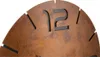 A close-up view of a clock face with Roman numerals. Produktbild-Vorschau