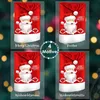 A collage of four Christmas-themed chair covers, each featuring a Santa Claus design. The background is a blurred Christmas tree with bokeh lights. Produktbild-Vorschau