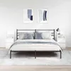 A bedroom scene with a bed, nightstands, and artwork. Náhľad obrázku produktu