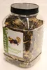 A clear, well-lit studio shot of a plastic jar filled with dried forest mushrooms, with a prominent label on the front. Produktbild-Vorschau