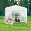Two children are having a picnic under a white canopy tent in a grassy yard. Voir les images du produit