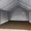 Interior view of a large, empty grey tent or shelter with a metal frame. Voir les images du produit