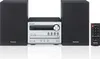 A Panasonic micro stereo system with two speakers and a remote control, displayed on a white background. Podgląd zdjęcia produktu