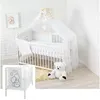 A white baby crib with bedding and a canopy, decorated with gold stars and teddy bear motifs. A large white teddy bear sits on a fluffy rug next to the crib. Anteprima dell’immagine prodotto