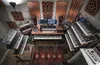 A music studio filled with synthesizers and audio equipment. Podgląd zdjęcia produktu