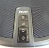 A close-up of a control panel with buttons and a brand logo. Produktbild-Vorschau