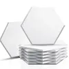 A stack of white hexagonal acoustic panels with two panels in the background. Produktbild-Vorschau