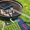A sandwich maker and its carrying bag are placed on a charcoal grill. Produktbild-Vorschau