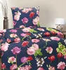A close-up view of a floral patterned duvet cover and pillowcase set on a bed. Produktbild-Vorschau