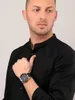 A man wearing a black shirt and a Maserati watch. Produktbild-Vorschau