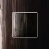 A close-up view of dark wood grain with a white border. Produktbild-Vorschau