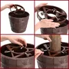 A collage of four images showing the assembly of a Christmas tree stand. Voir les images du produit