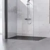 A modern shower tray with a marble-tiled shower wall and a chrome shower fixture. Náhled obrázku produktu