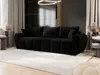 A modern living room with a black sofa, decorative elements, and curtains. Voir les images du produit