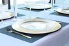 A table setting with plates, glasses, and placemats. Podgląd zdjęcia produktu