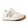 A side view of a New Balance sneaker with a leopard print accent. Voir les images du produit