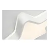A close-up view of a modern, abstract ceiling light fixture with curved white elements and a soft, warm light emanating from within. Produktbild-Vorschau