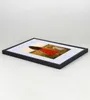 A framed picture of a woman in a red dress in a field. Produktbild-Vorschau