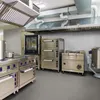 A professional shot of a commercial kitchen with various stainless steel appliances. Podgląd zdjęcia produktu