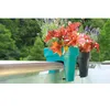 Two balcony planters with plants are attached to a railing. Anteprima dell’immagine prodotto