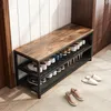 A shoe rack with a wooden top and multiple shelves filled with shoes, placed in a hallway next to a door. Podgląd zdjęcia produktu