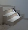Two solar stair lights illuminate a set of outdoor stairs. Produktbild-Vorschau